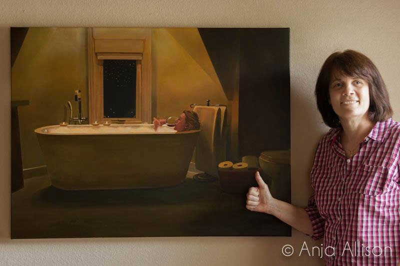 Anja Allison in front of one of her paintings